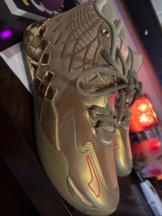 Gold Athletic Sneakers with Red Accent
